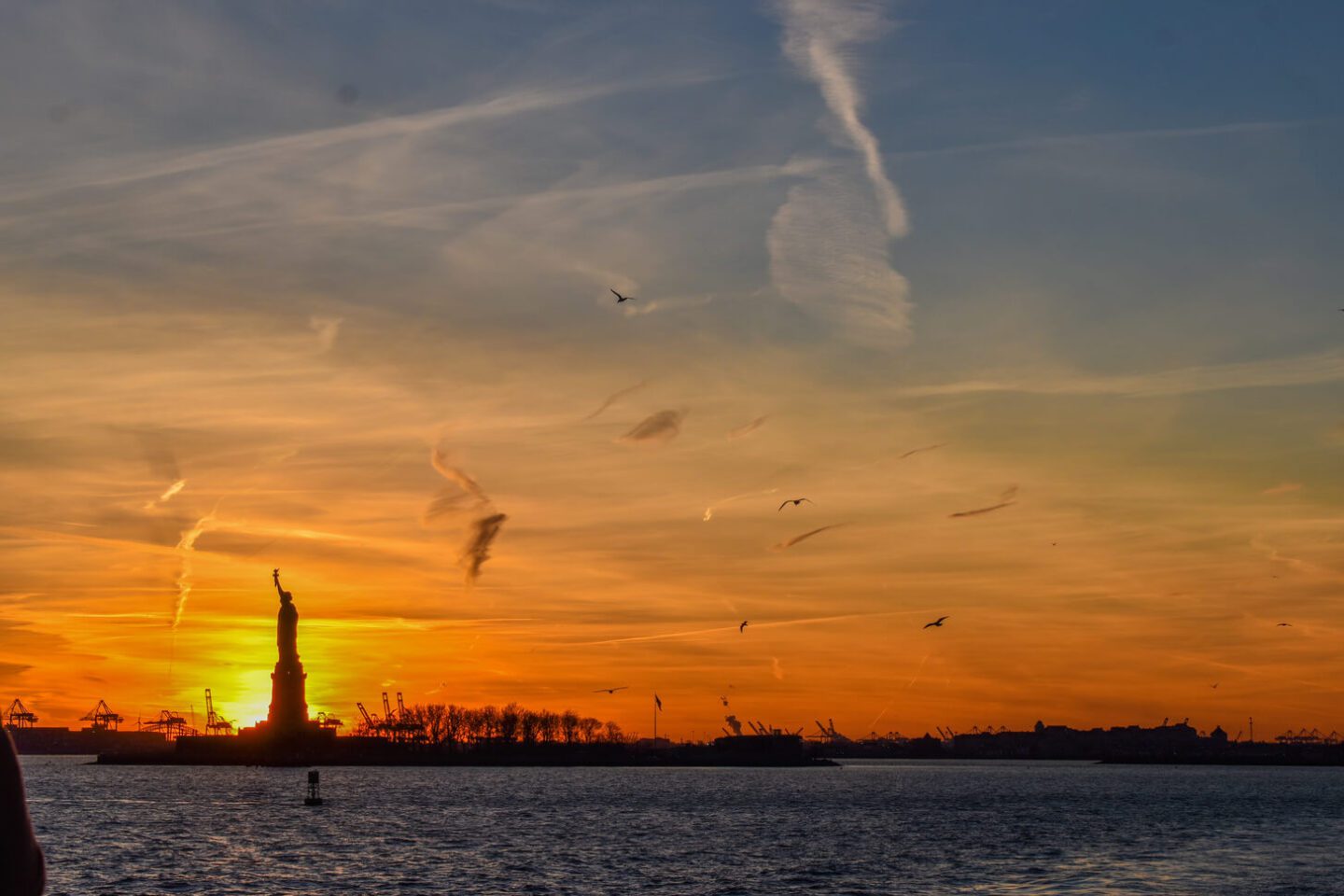 Go on a sunset cruise to see the Statue of Liberty - New York at night activities